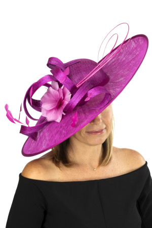 Magenta fascinator with sinamay loops, feather flower and quills
