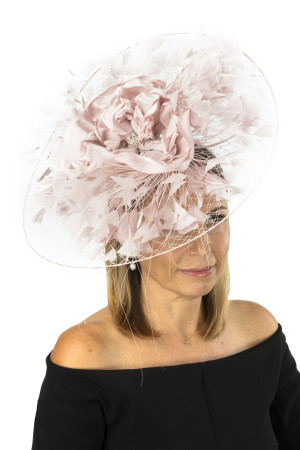 Blush fascinator on a veiling disc