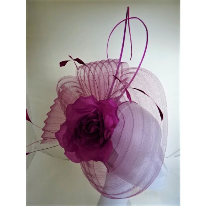 Magenta pleated crin fascinator, with a soft rose fine feathers and quills
