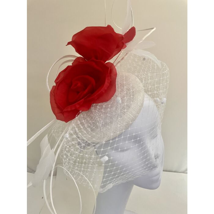 White and red fascinator with roses, veiling, and quills