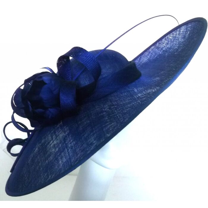 Royal blue fascinator with a feather flower and sinamay twists